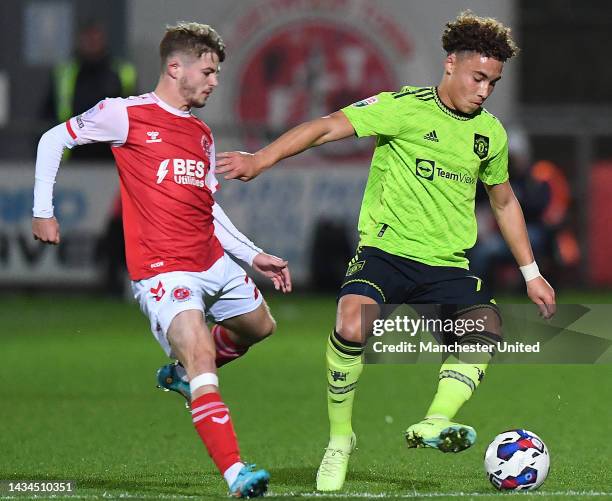 Sam Murray of Manchester United U21s in action with Cian Hayes of Fleetwood during the Papa John's Trophy match between Fleetwood and Manchester...