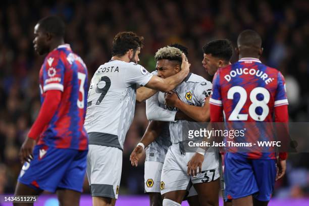 Adama Traore celebrates with Diego Costa of Wolverhampton Wanderers after scoring their team's first goal during the Premier League match between...