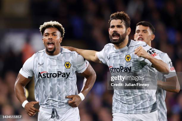 Adama Traore celebrates with Diego Costa of Wolverhampton Wanderers after scoring their team's first goal during the Premier League match between...