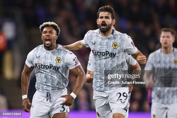 Adama Traore celebrates with Diego Costa of Wolverhampton Wanderers after scoring their team's first goal during the Premier League match between...