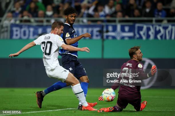 Aaron Seydel of SV Darmstadt 98 scores their team's second goal past Tobias Sippel of Borussia Monchengladbach during the DFB Cup second round match...