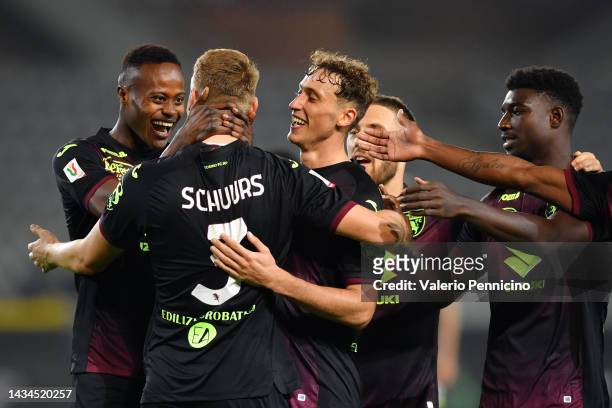 Perr Schuurs of Torino FC celebrates with teammates after scoring their team's third goal during the Coppa Italia match between Torino FC and...
