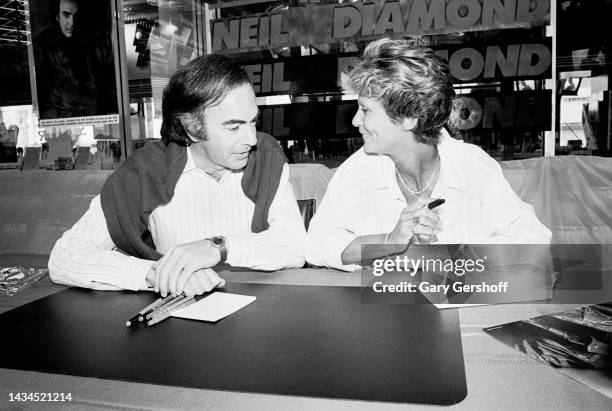 View of married American couple, Pop musician Neil Diamond and Marcia Murphey, during an in-store at Tower Records, New York, New York, July 24,...