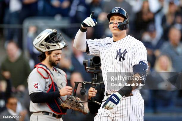Aaron Judge of the New York Yankees reacts after hitting a home run against the Cleveland Guardians during the second inning in game five of the...