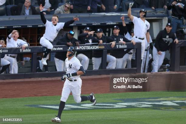 Aaron Judge of the New York Yankees hits a home run against the Cleveland Guardians during the second inning in game five of the American League...