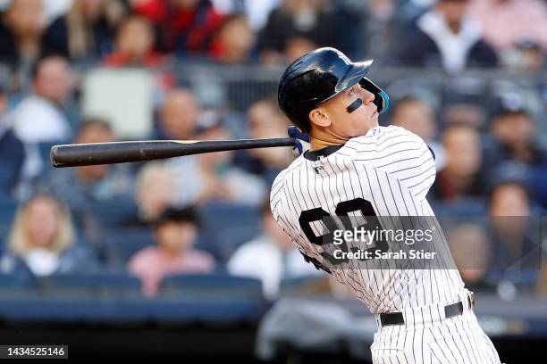 Aaron Judge of the New York Yankees hits a home run against the Cleveland Guardians during the second inning in game five of the American League...