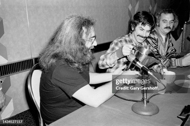 View, from left, of American Rock musicians Jerry Garcia , Mickey Hart, and Bill Kreutzmann, all of the group Grateful Dead, during a press...