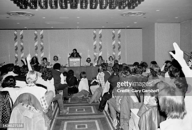View, over attendees, of American Rock band manager Rock Scully , of the Grateful Dead, speaks from a lectern during a press conference at the NY...