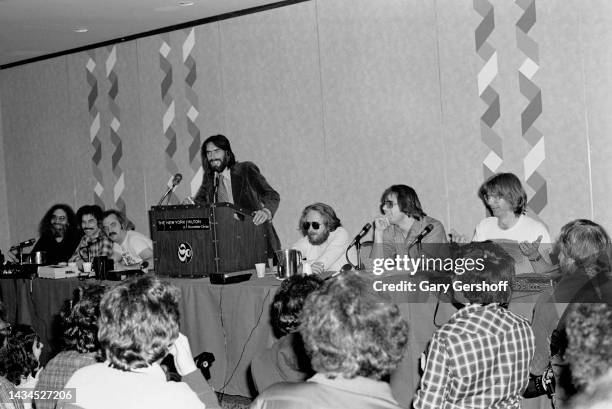 View, over attendees, of American Rock band manager Rock Scully , of the Grateful Dead, speaks from a lectern during a press conference at the NY...