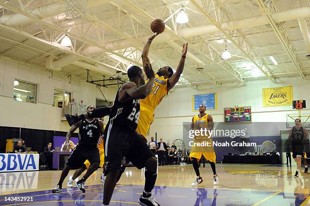 Orien Greene of the Los Angeles D-Fenders shoots against Flip Murray of the Austin Toros at Toyota Sports Center during game two of the 2012 NBA...