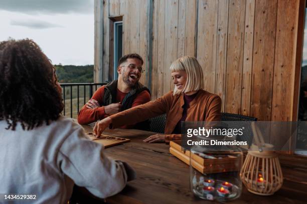 joyful friends weekend in mountains. - dating game stock pictures, royalty-free photos & images