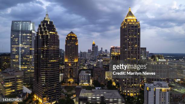 illuminated skyscrapers line the atlanta city sky at dusk - "marilyn nieves" stock pictures, royalty-free photos & images