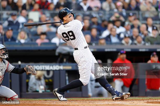 Aaron Judge of the New York Yankees hits a home run against the Cleveland Guardians during the second inning in game five of the American League...