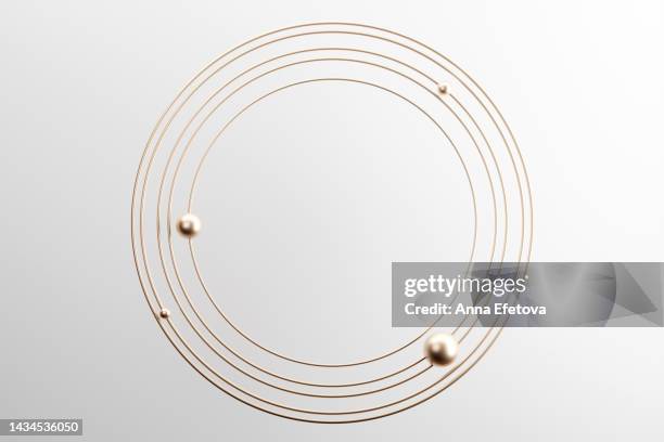 cosmic 3d frame made with golden spheres and circles on white background. festive luxury design with copy space - satellite orbiting stock pictures, royalty-free photos & images