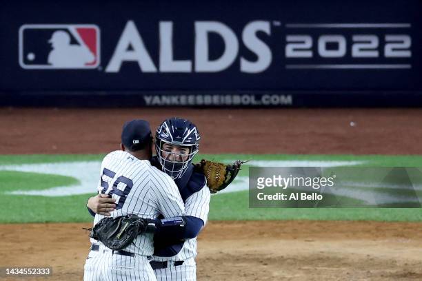 Wandy Peralta and Jose Trevino of the New York Yankees celebrate after defeating the Cleveland Guardians in game five of the American League Division...
