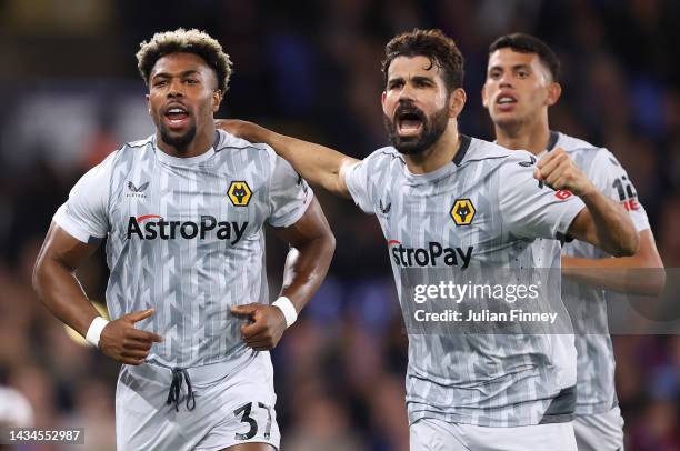 Adama Traore celebrates with Diego Costa of Wolverhampton Wanderers after scoring their team's first goal during the Premier League match between...