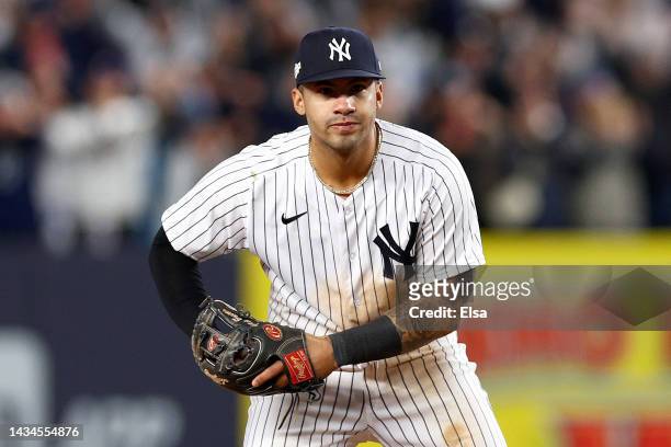 Gleyber Torres of the New York Yankees celebrates making the last out of the play to beat the Cleveland Guardians in game five of the American League...