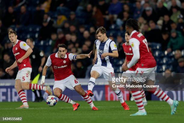 Jayson Molumby of West Bromwich Albion passes the ball ahead of Matty James of Bristol Cityduring the Sky Bet Championship between West Bromwich...