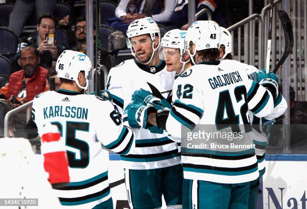 The San Jose Sharks celebrate a first period goal by Nico Sturm against the New York Islanders at UBS Arena on October 18, 2022 in Elmont, New York.