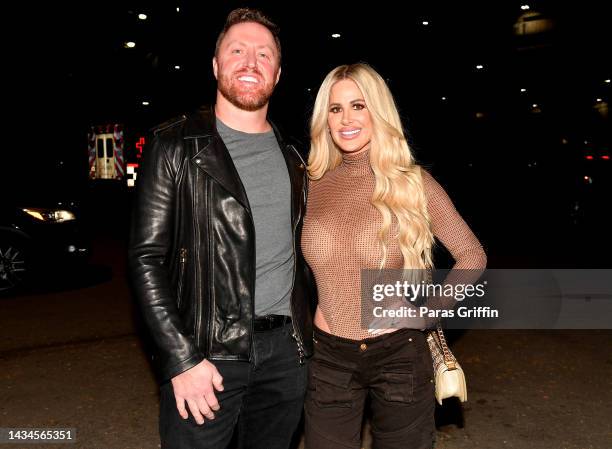 Kroy Biermann and Kim Zolciak-Biermann are seen arriving outside the Post Malone concert at State Farm Arena on October 18, 2022 in Atlanta, Georgia.