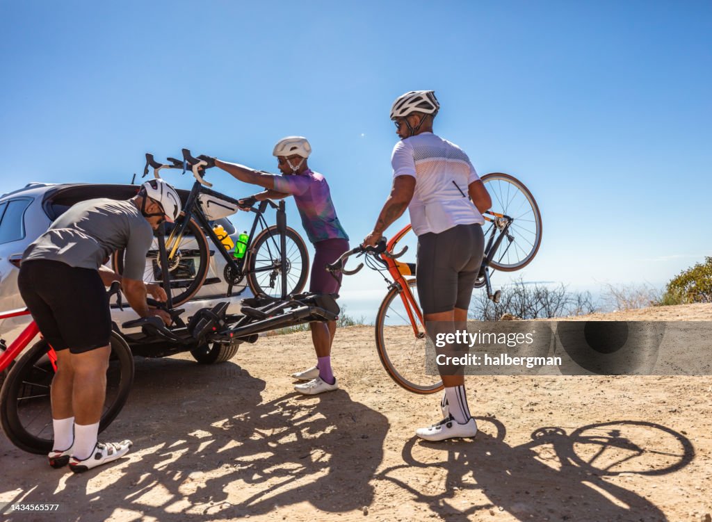 Black Male Cyclists Racking Bicycles After a Ride