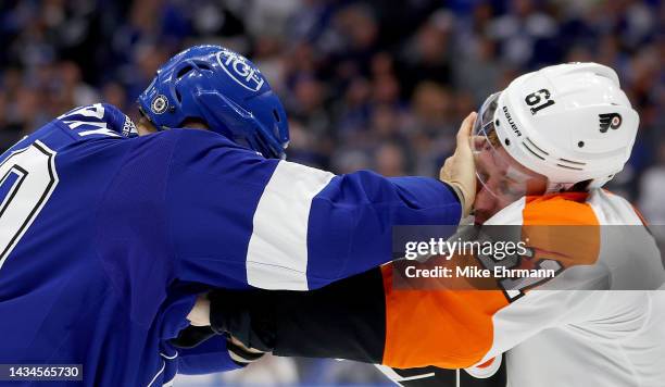 Corey Perry of the Tampa Bay Lightning and Justin Braun of the Philadelphia Flyers fight during a game at Amalie Arena on October 18, 2022 in Tampa,...