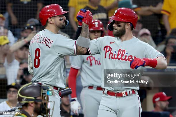 Bryce Harper of the Philadelphia Phillies celebrates with Nick Castellanos after hitting a home run during the fourth inning against the San Diego...