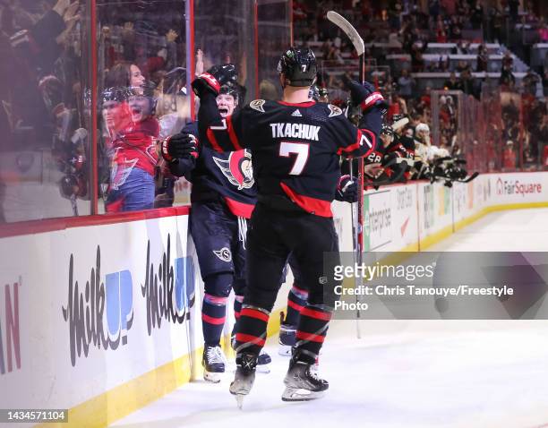 Tim Stützle of the Ottawa Senators celebrates his second-period goal against the Boston Bruins with Brady Tkachuk at Canadian Tire Centre on October...