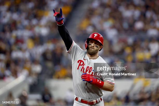 Bryce Harper of the Philadelphia Phillies reacts after hitting a home run during the fourth inning against the San Diego Padres in game one of the...