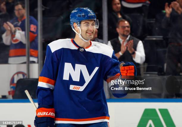 Adam Pelech of the New York Islanders celebrates a goal by Anders Lee against the San Jose Sharks during the second period at UBS Arena on October...
