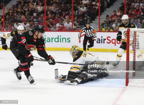 Tim Stützle of the Ottawa Senators scores against Jeremy Swayman of the Boston Bruins in the second period at Canadian Tire Centre on October 18,...