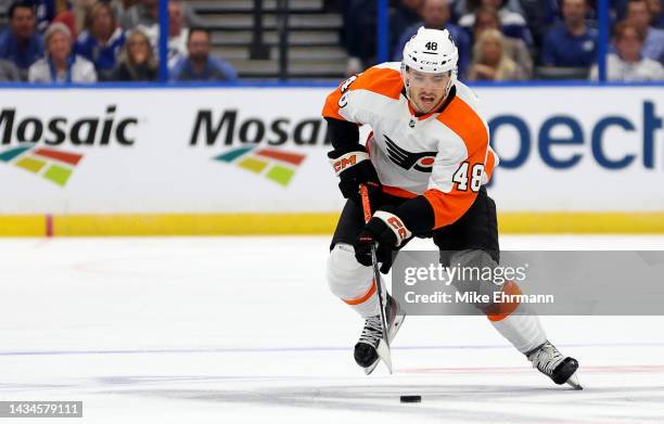 Morgan Frost of the Philadelphia Flyers looks to pass during a game against the Tampa Bay Lightning at Amalie Arena on October 18, 2022 in Tampa,...
