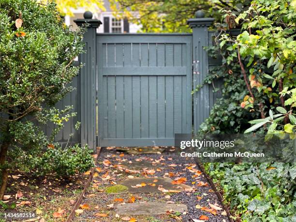 closed wooden residential gate in autumn - gate locks for wood fences stock pictures, royalty-free photos & images
