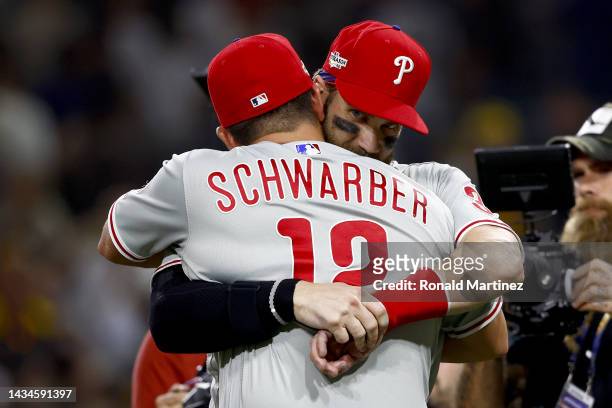 Kyle Schwarber of the Philadelphia Phillies celebrates with Bryce Harper after defeating the San Diego Padres 2-0 in game one of the National League...