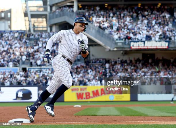 Aaron Judge of the New York Yankees rounds the bases after hitting a home run against the Cleveland Guardians during the second inning in game five...