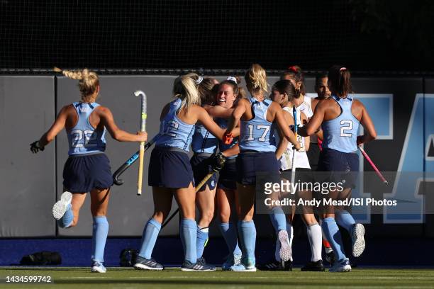 Erin Matson of the University of North Carolina is mobbed by teammates while celebrating her goal during a game between Wake Forest and North...
