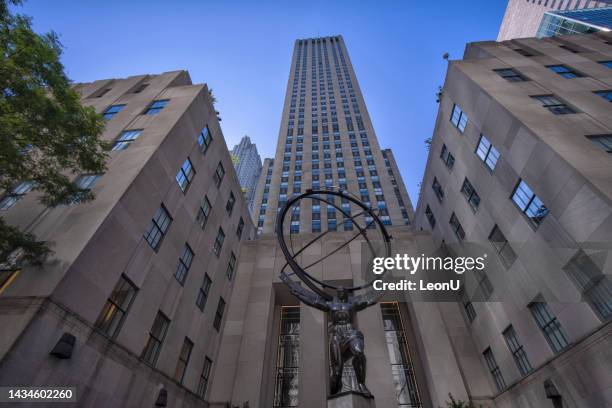 atlas statue in front of the rockefeller center in new york city - atlas statue stock pictures, royalty-free photos & images