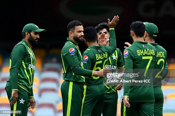 Mohammad Nawaz of Pakistan celebrates with team mates after dismissing Najibullah Zadran of Afghanistan during the ICC 2022 Men's T20 World Cup Warm...