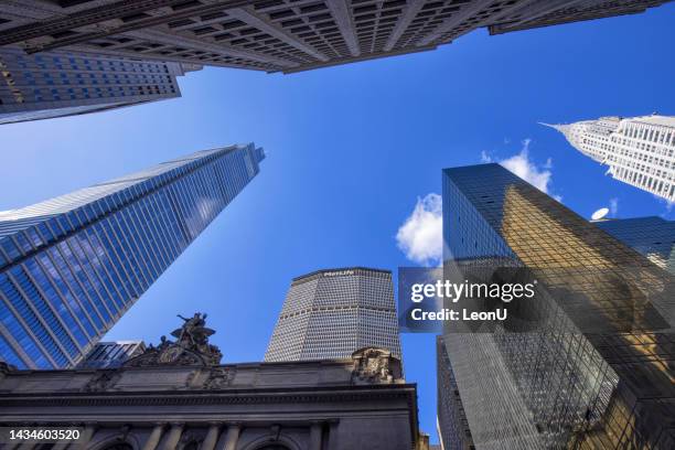 up view of grand central terminal and new york city midtown manhattan skyscrapers - the chrysler building and grand central station stock pictures, royalty-free photos & images