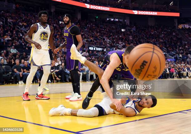 Matt Ryan of the Los Angeles Lakers and Stephen Curry of the Golden State Warriors compete for a loose ball during the 1st half of the game at Chase...