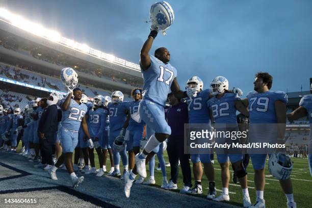 Chris Collins of the University North Carolina leads his team in celebration after a game between Virginia Tech and North Carolina at Kenan Memorial...