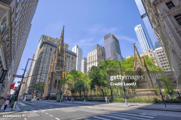 street view of new york city lower manhattan intersection - trinity church new york stock pictures, royalty-free photos & images