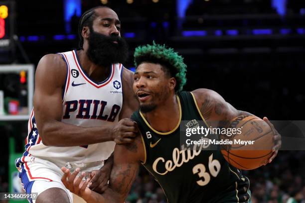 Marcus Smart of the Boston Celtics drives towards the basket against James Harden of the Philadelphia 76ers during the second half at TD Garden on...