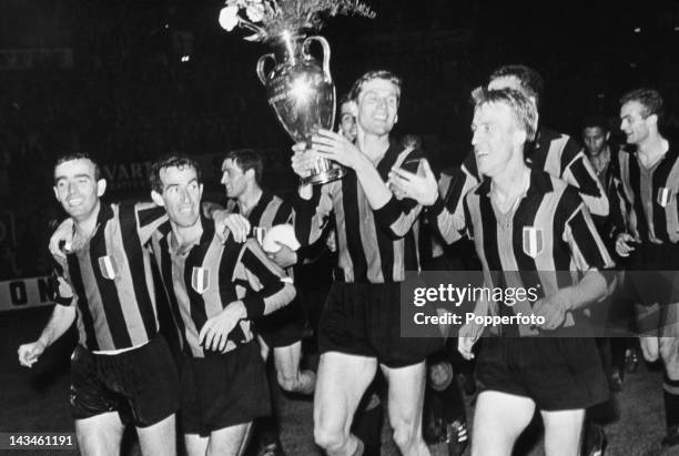 Members of the Inter Milan team with the trophy after beating Real Madrid 3-1 in the European Cup Final at the Prater Stadium, Vienna, 27th May 1964.