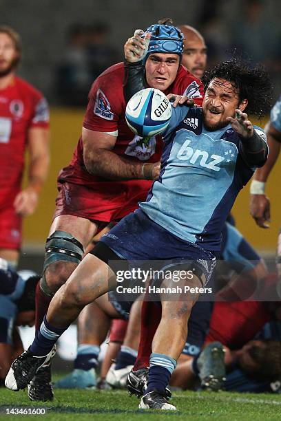 James Horwill of the Reds tackles Piri Weepu of the Blues during the round 10 Super Rugby match between the Blues and the Reds at Eden Park on April...