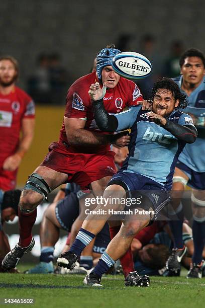 James Horwill of the Reds tackles Piri Weepu of the Blues during the round 10 Super Rugby match between the Blues and the Reds at Eden Park on April...