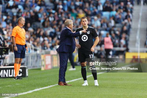 Adrian Heath head coach of Minnesota United FC talks with Robin Lod of Minnesota United FC during a game between Vancouver Whitecaps and Minnesota...