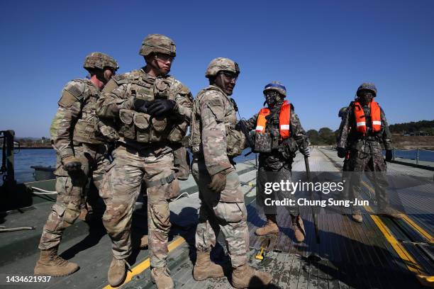 And South Korean soldiers participate in a river crossing exercise on October 19, 2022 in Yeoju, South Korea. North Korea's military said Wednesday...