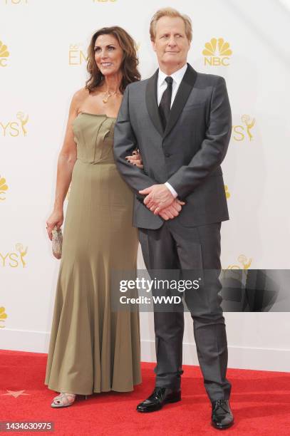 Kathleen Treado and Jeff Daniels attend 66th Primetime Emmy Awards at Nokia Theatre L.A. Live. Treado wears Prada.