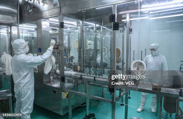 Staff members work on the production line of penicillin antibiotics at a workshop of China Meheco Kangli Pharma Co., Ltd on October 17, 2022 in...